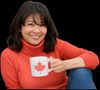 Charlene holding a mug with a maple leaf