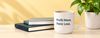 Profit More. Panic Less. mug on a desk